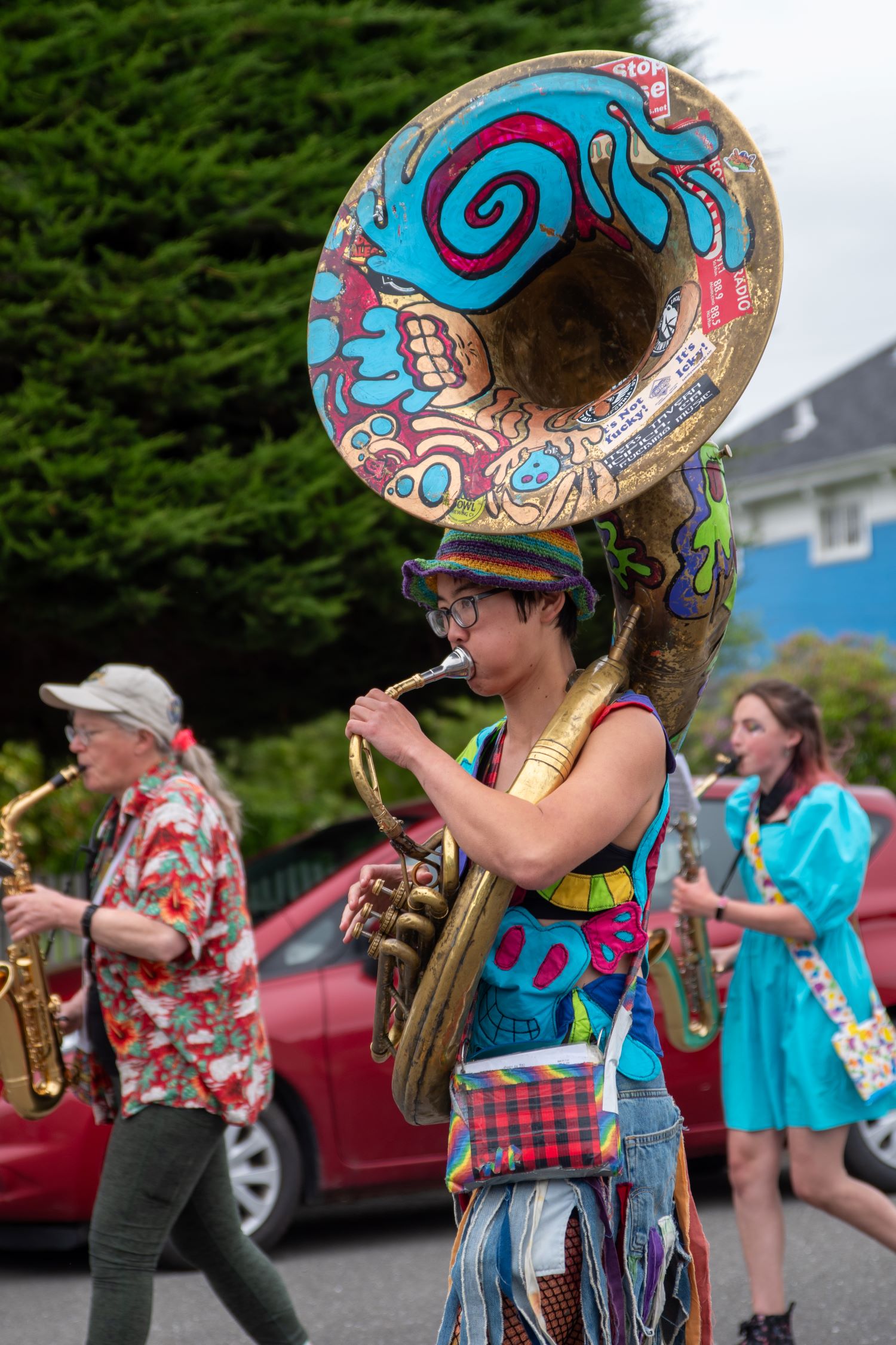 Performer playing tuba at a Pride event